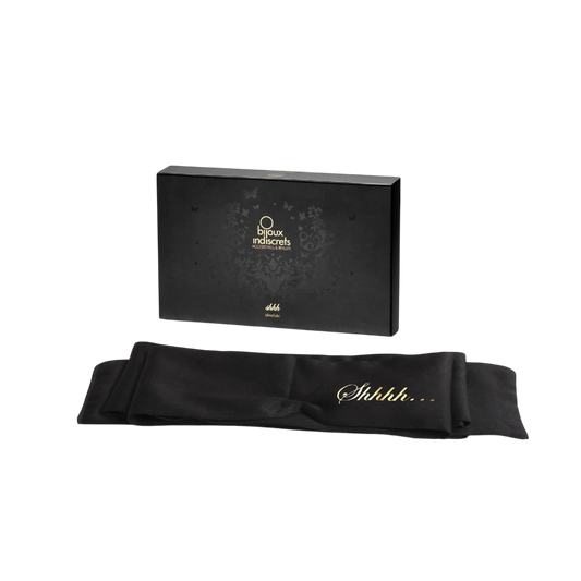 Élégant bandeau en satin noir Shhh de Bijoux Indiscrets dans son emballage raffiné, invitation à la complicité sensuelle chez Oh My God'Z