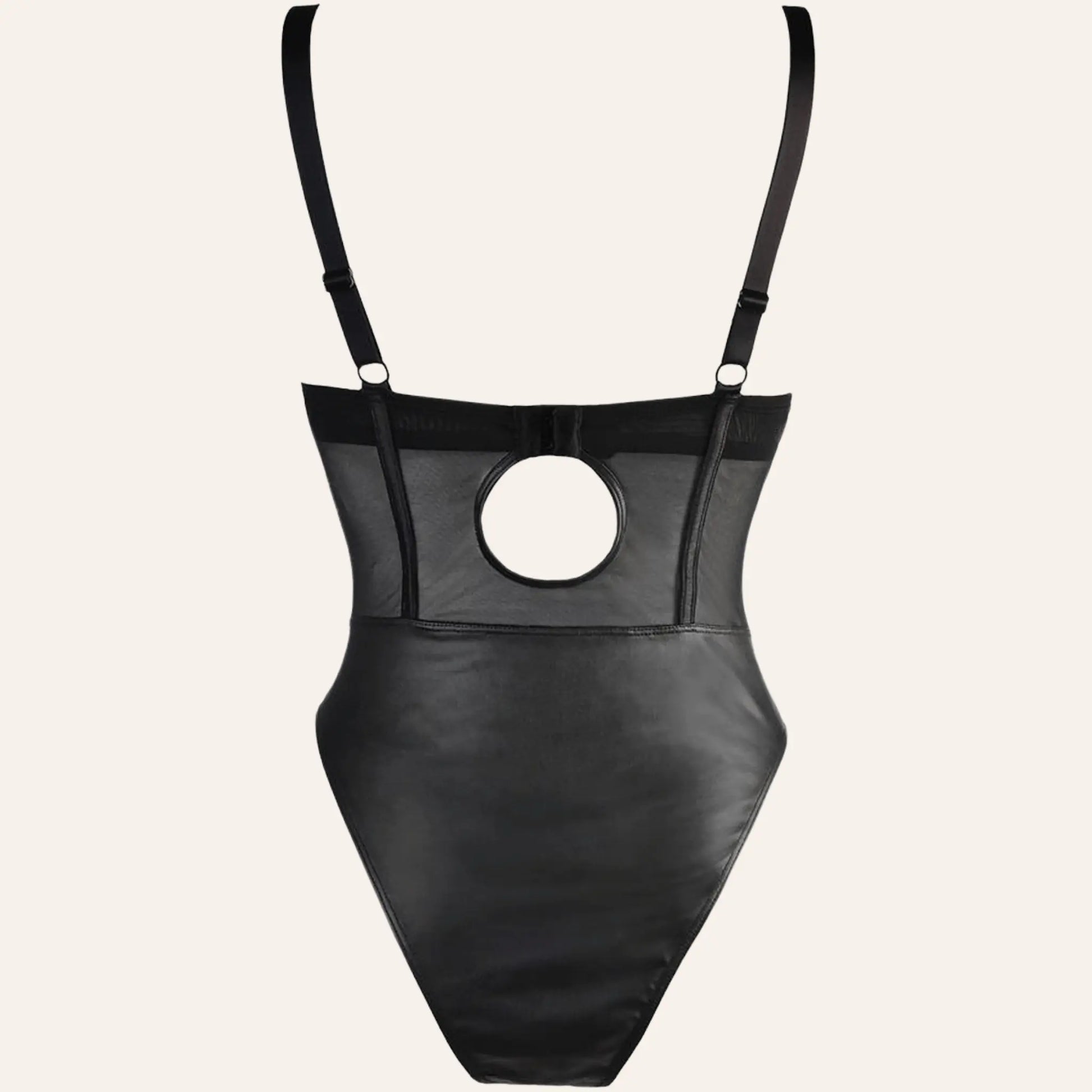 Vue arrière du body V-10590 par Axami, disponible chez Oh My God'Z. Ce body noir présente un design audacieux avec une découpe au dos, ajoutant une touche de séduction supplémentaire.