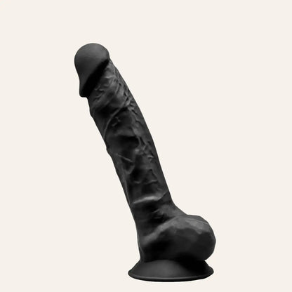 Gode noir SilexD modèle 1 à double densité, en silicone haut de gamme, avec effet veiné et ventouse pour des jeux en solo ou à deux. Ce sextoy réaliste et puissant est disponible sur la boutique Oh My God'Z, référence en accessoires intimes de luxe.