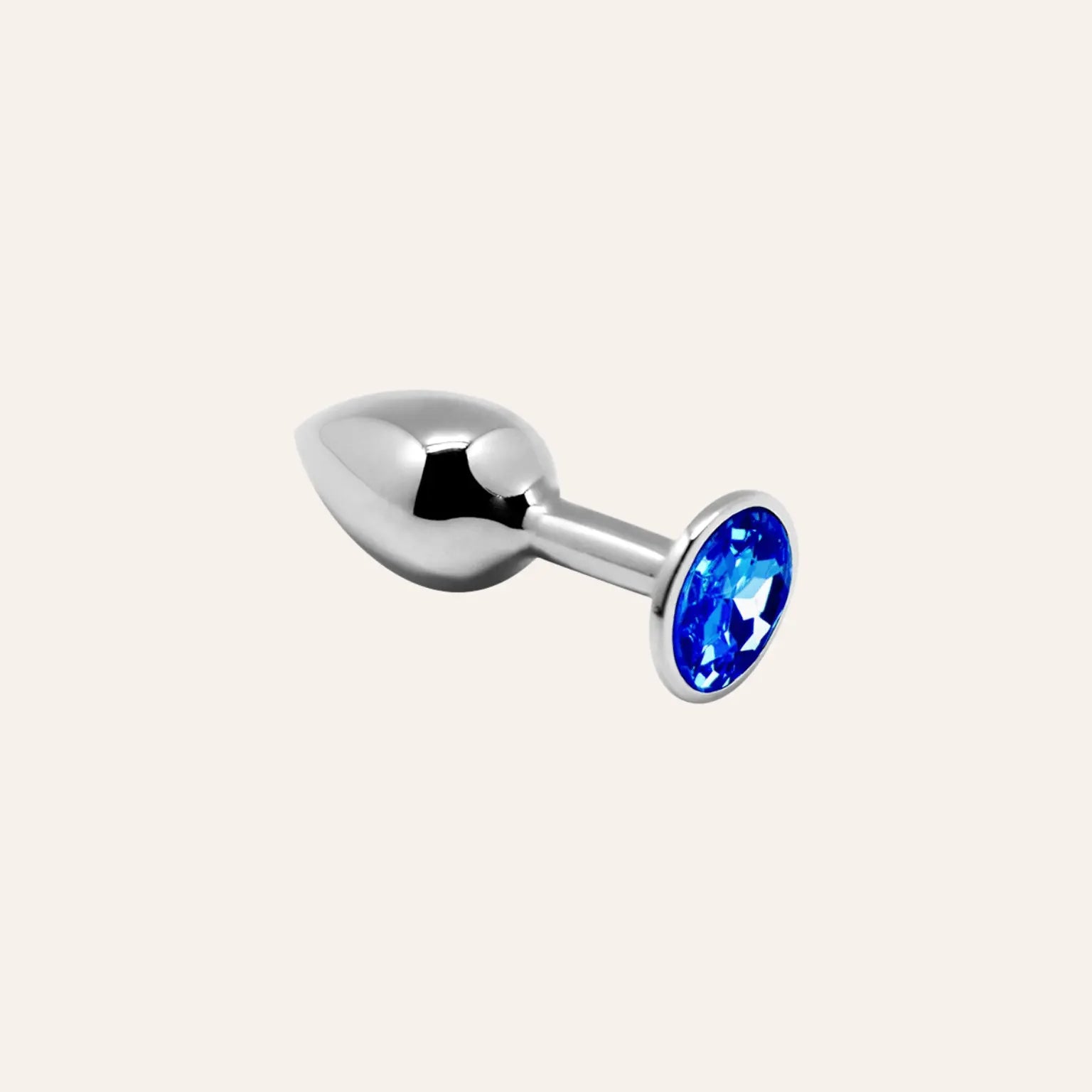 Plug anal métallique avec bijou bleu brillant, conçu pour un confort optimal et un design sophistiqué. Disponible chez Oh My God'Z, votre référence en sextoys haut de gamme.