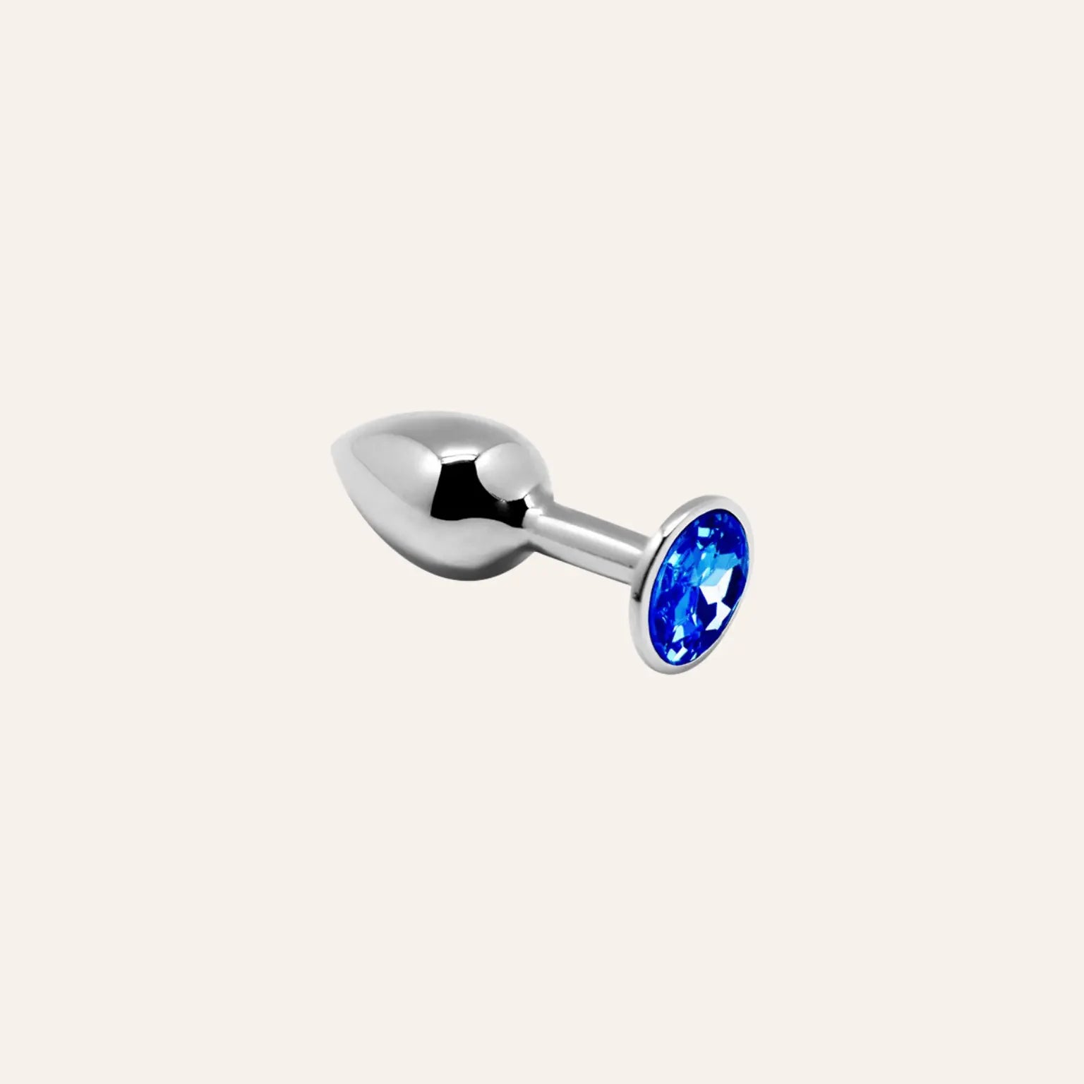 Plug anal en métal argenté orné d’un bijou bleu éclatant, parfait pour explorer le plaisir tout en élégance. Disponible exclusivement dans la boutique Oh My God'Z.