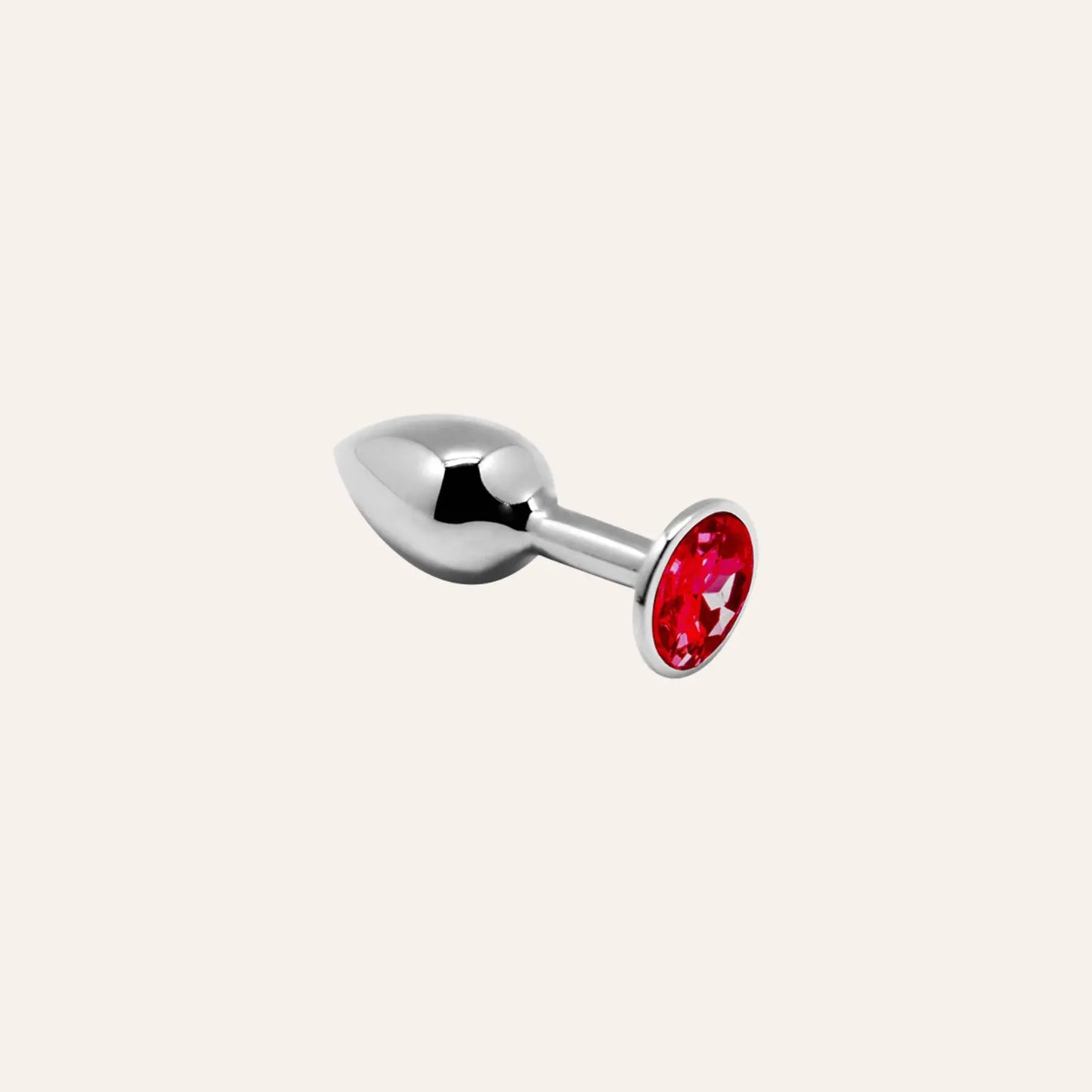 Plug anal luxueux en métal argenté avec bijou rouge, conçu pour le confort et l’esthétique. Un produit exclusif pour amateurs de plaisir sophistiqué, disponible chez Oh My God'Z.