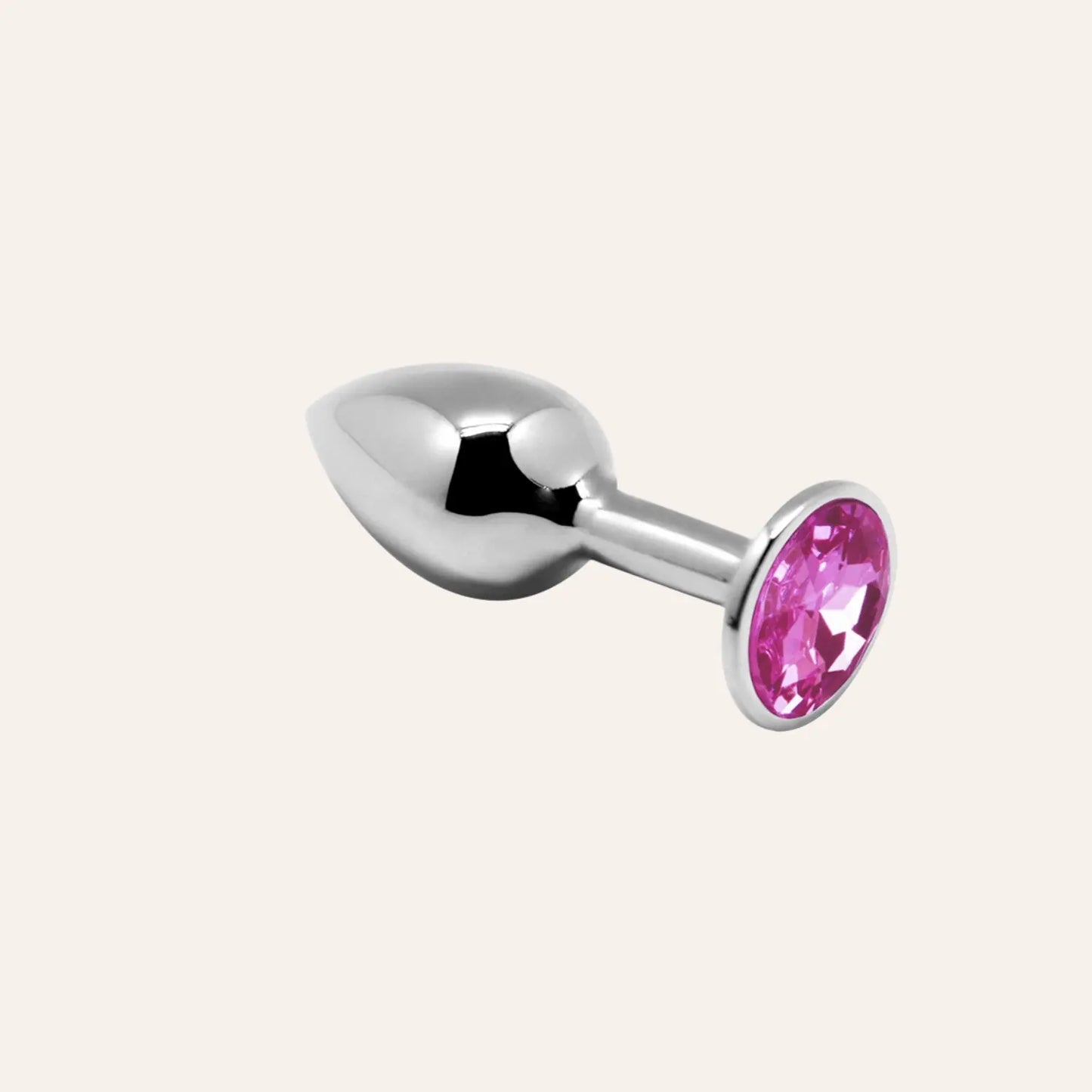 Élégant plug anal métallique avec bijou rose scintillant, idéal pour ajouter une touche glamour à vos expériences sensuelles. Disponible chez Oh My God'Z, spécialiste des sextoys haut de gamme.