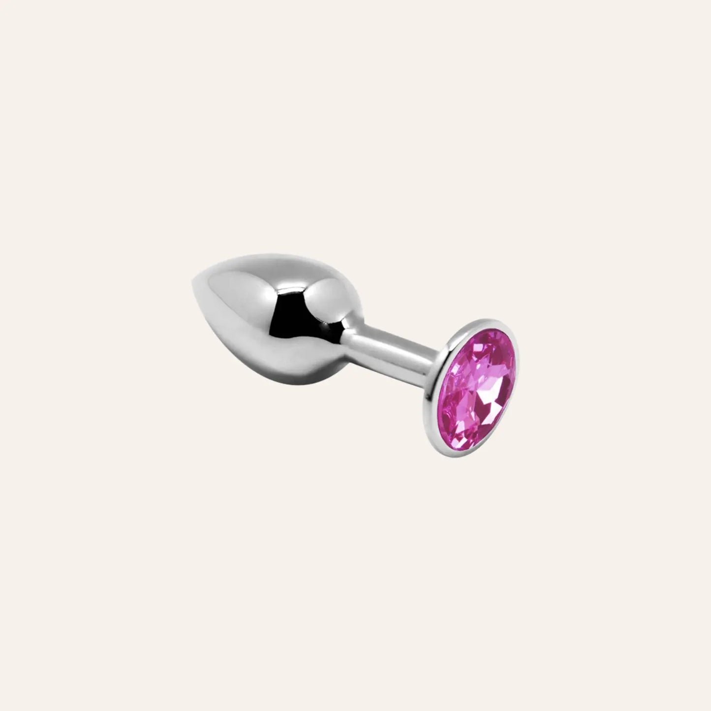 Mini plug anal en métal argenté avec bijou rose, idéal pour explorer en toute sécurité le plaisir anal raffiné. Une création luxueuse à retrouver chez Oh My God'Z.