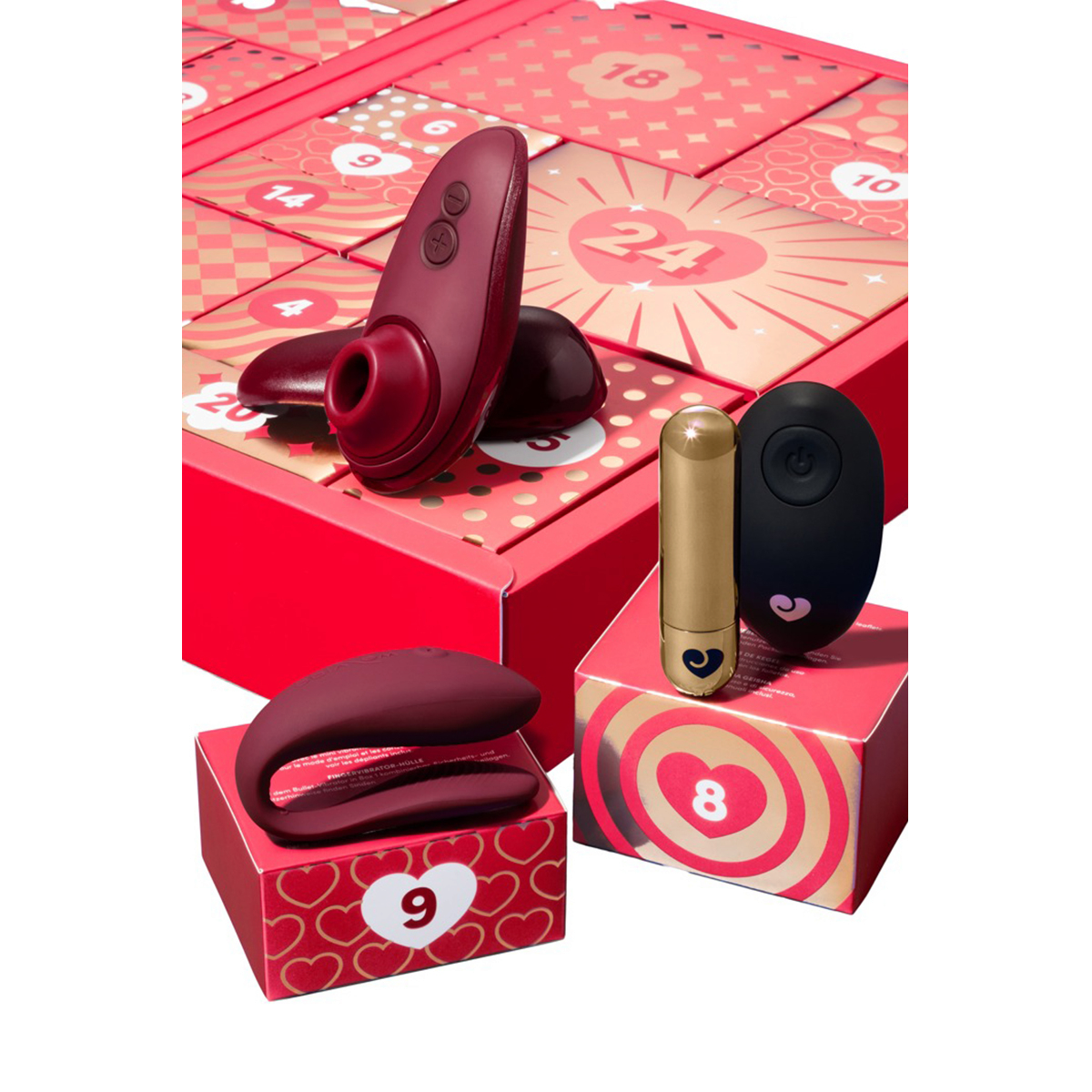 Stimulateur clitoridien bordeaux, vibromasseur couple et bullet dore avec telecommande sur coffrets rouges - Oh My God'Z