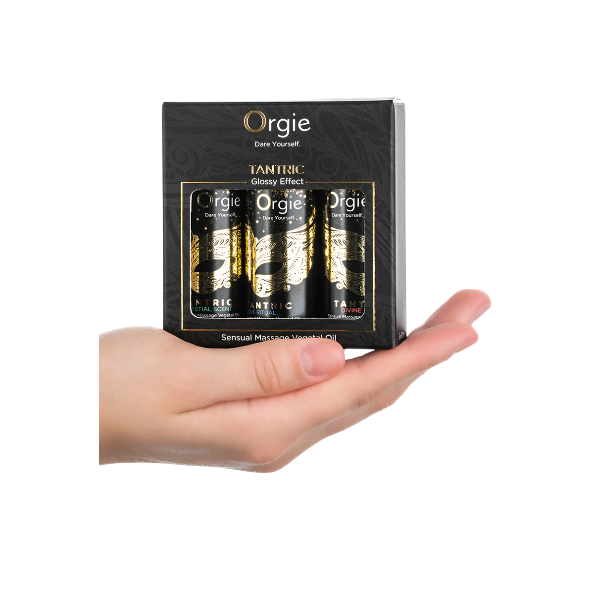 Mini coffret Orgie Tantric tenu dans une main, 3 flacons noirs d'huile de massage, format voyage - Oh My God'Z