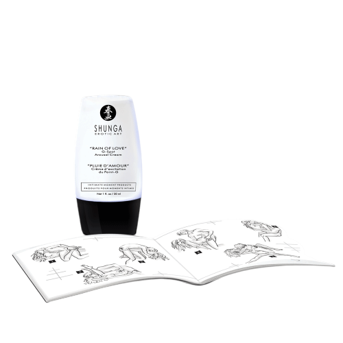Flacon de creme d'excitation point G Shunga blanc et noir pose pres d'un livret de positions - Oh My God'Z