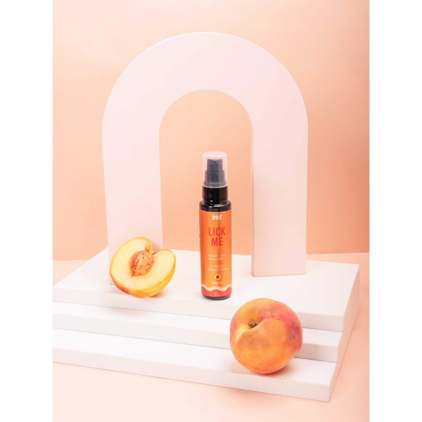 Gel chauffant embrassable Lick Me saveur pêche en flacon orange avec pompe et fruits - Oh My God'Z