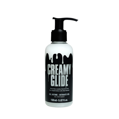 Gel intime Creamy Glide coulant en filaments lactés sur jambe en collant noir - Oh My God'Z
