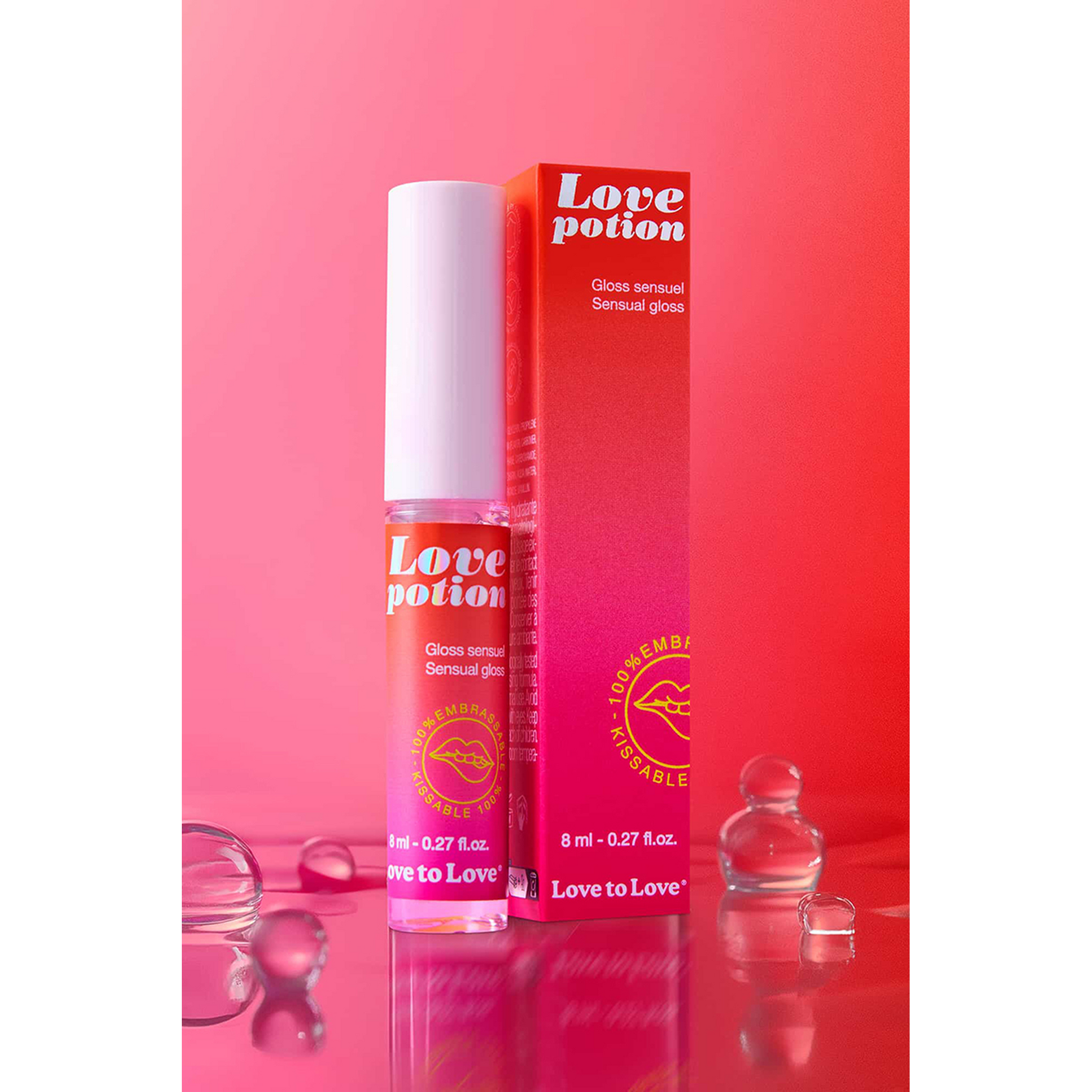 Flacon roll-on du gloss Love Potion et packaging rouge-rose avec illustration lèvres dorées - Oh My God'Z
