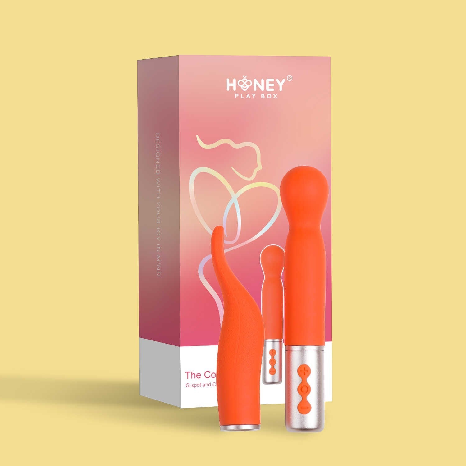 Coffret rose Honey Play Box avec deux vibromasseurs orange à têtes interchangeables sur fond jaune - Oh My God'Z